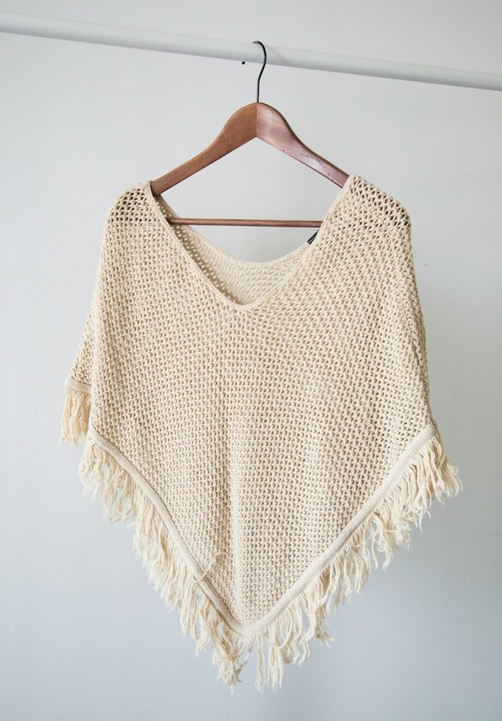 white-v-neck-shirt-on-brown-clothes-hanger-p8drpg-dulw